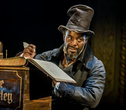 Paterson Joseph as Ebenezer Scrooge at the Old Vic