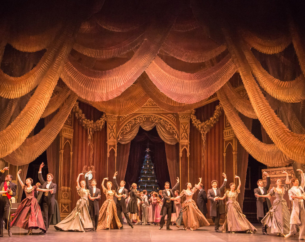 A grand party scene in The Nutcracker at the London Coliseum.