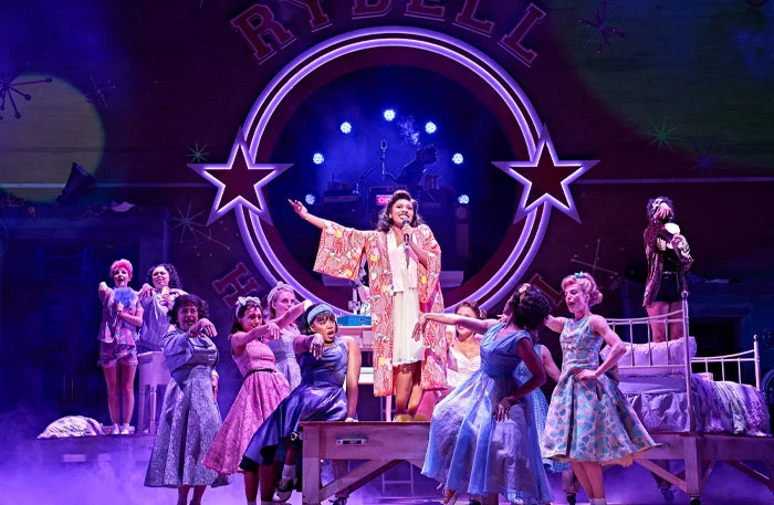 Lizzy-Rose Esin-Kelly (Marty) and the company of Grease at the Dominion Theatre