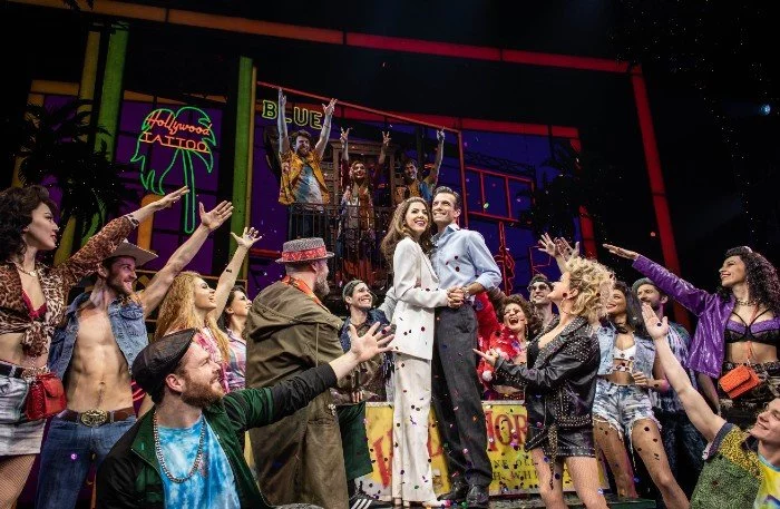 Aimie Atkins as Vivian Ward, Danny Mac as Edward Lewis and the cast of Pretty Woman the Musical at the Piccadilly Theatre
