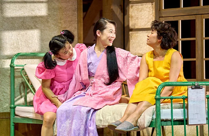 Mei Mac (Mei), Haruka Abe (Yasuko) and Ami Okumura Jones (Satsuki) in My Neighbour Totoro at the Barbican Theatre
