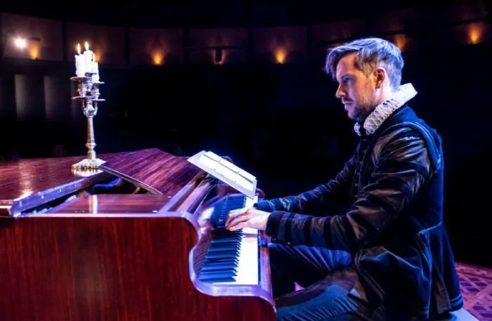 composer Michael Bruce playing the piano onstage for As You Like It at Soho Place Theatre
