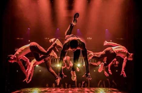 The cast of Magic Mike Live dancing on stage in London