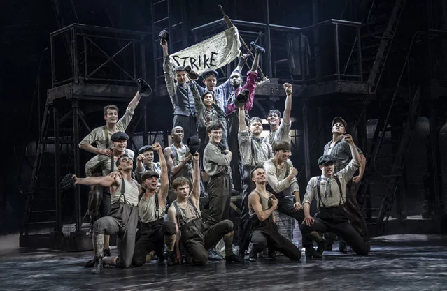 The cast of Newsies on stage at Wembley Park Theatre
