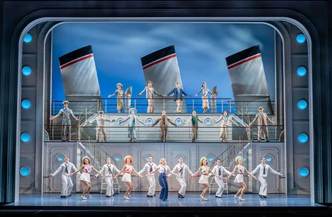 The cast of Anything Goes performing a group number at the Barbican Theatre