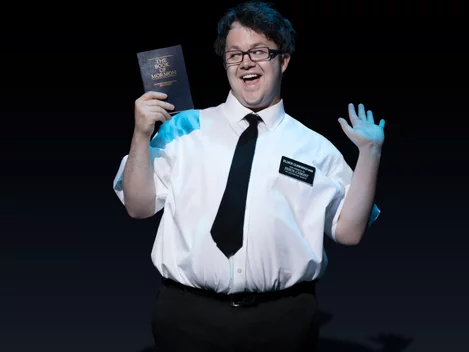 Cody Jamison Strand as Elder Cunningham in The Book of Mormon on Broadway