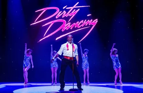 Colin Charles and the ensemble in Dirty Dancing at the Dominion Theatre