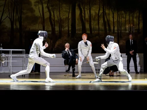 Claudius and Hamlet fence in the National Theatre's 2025 production of Hamlet