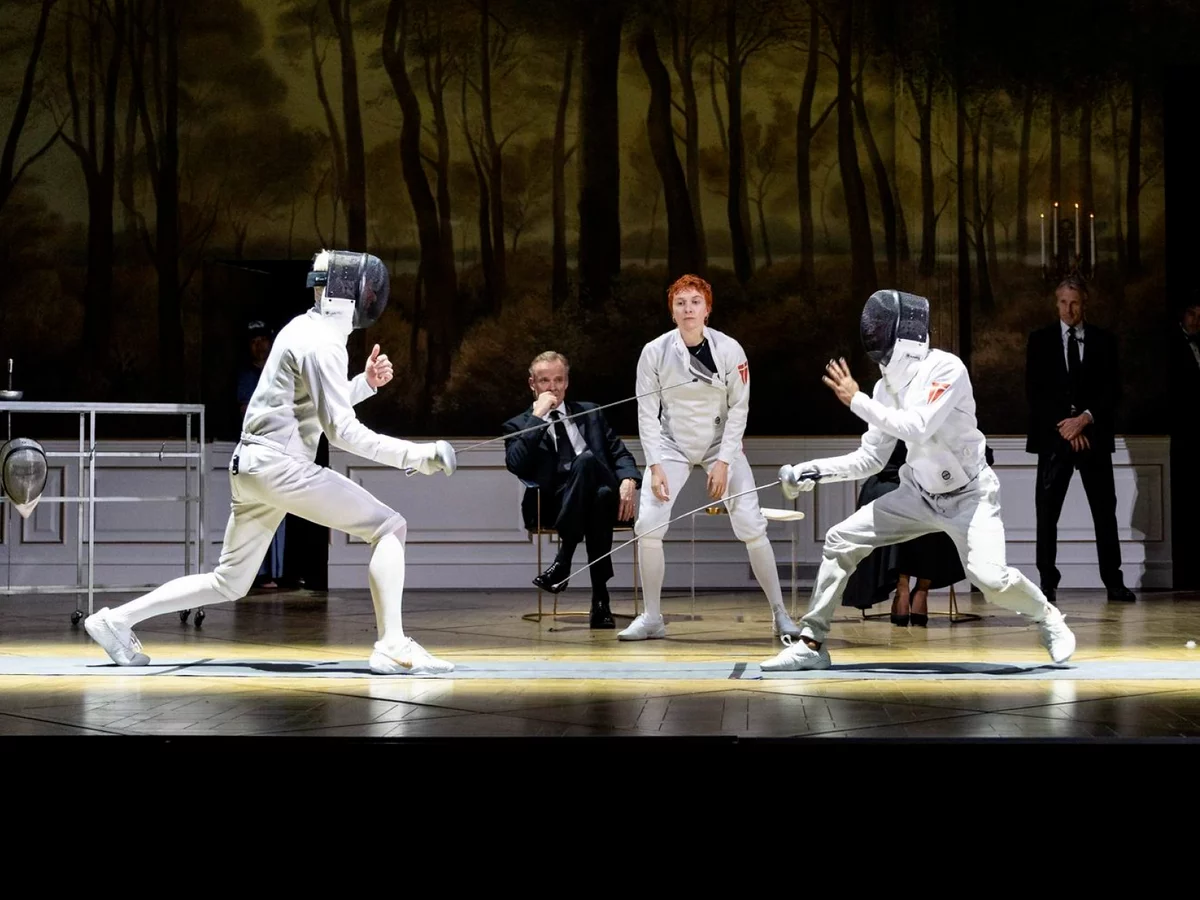 Claudius and Hamlet fence in the National Theatre's 2025 production of Hamlet