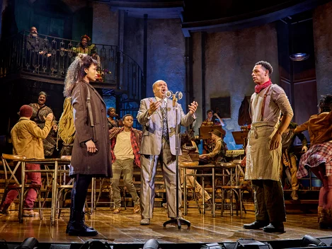 Eurydice (Bethany Antonia), Hermes (Clive Rowe), and Orpheus (Marley Fenton) in Hadestown at London's Lyric Theatre