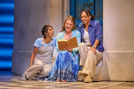 The cast perform "Honey, Honey" in Mamma Mia!, West End