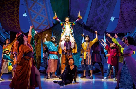 Jac Yarrow as Joseph, Alexandra Burke as The Narrator, and the cast of Joseph and the Amazing Technicolor Dreamcoat at the London Palladium