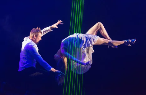 Jamie Allan and assistant performing in Amaze