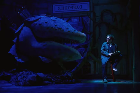 Audrey II and Seymour (Ethan Slater) in Little Shop of Horrors at the Westside Theatre