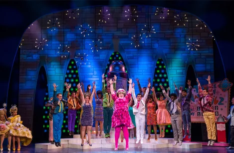Lizzie Bea (Tracy Turnblad) and the company of Hairspray at the London Coliseum