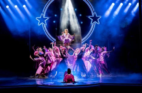 Louise Redknapp as Teen Angel and the cast of Grease