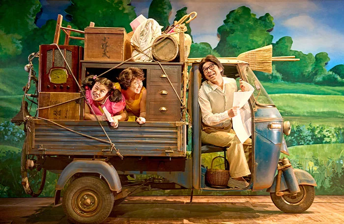 Mei Mac (Mei), Ami Okumura Jones (Satsuki) and Dai Tabuchi (Tatsuo) in My Neighbour Totoro at the Barbican Theatre