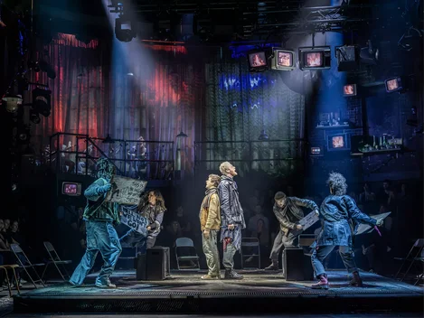 Gaten Matarazzo (Mark) and Travis Ross (Roger) star in Rent