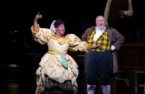 Sandra Marvin as Mrs Fezziwig and Martyn Ellis as Mr Fezziwig in A Christmas Carol at the Dominion Theatre
