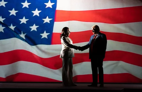 Kamala Harris (Tamara Tunie) and Donald Trump (Bertie Carvel) shake hands in The 47th at the Old Vic