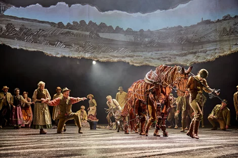 Albert (Tom Sturgess) guides Joey to plough in War Horse