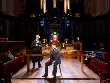Owen Warner as Leonard Vole and some of the cast of Witness for the Prosecution