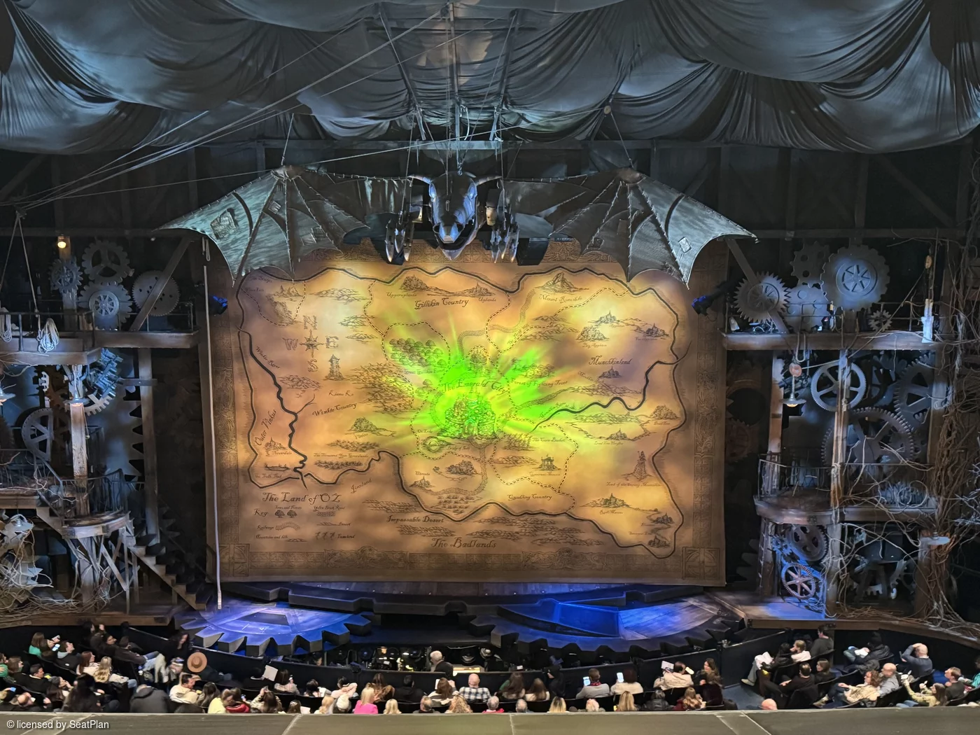 A seat view photo for Wicked Broadway It shows the stage at the Gershwin theatre, with the safety curtain down. as seen from the Mezzanine.