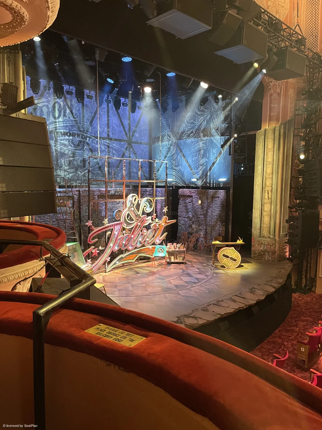 a seat view photo from box F1 at the Shafetesbury theatre, showing the set of &Juliet from a side on angle. 