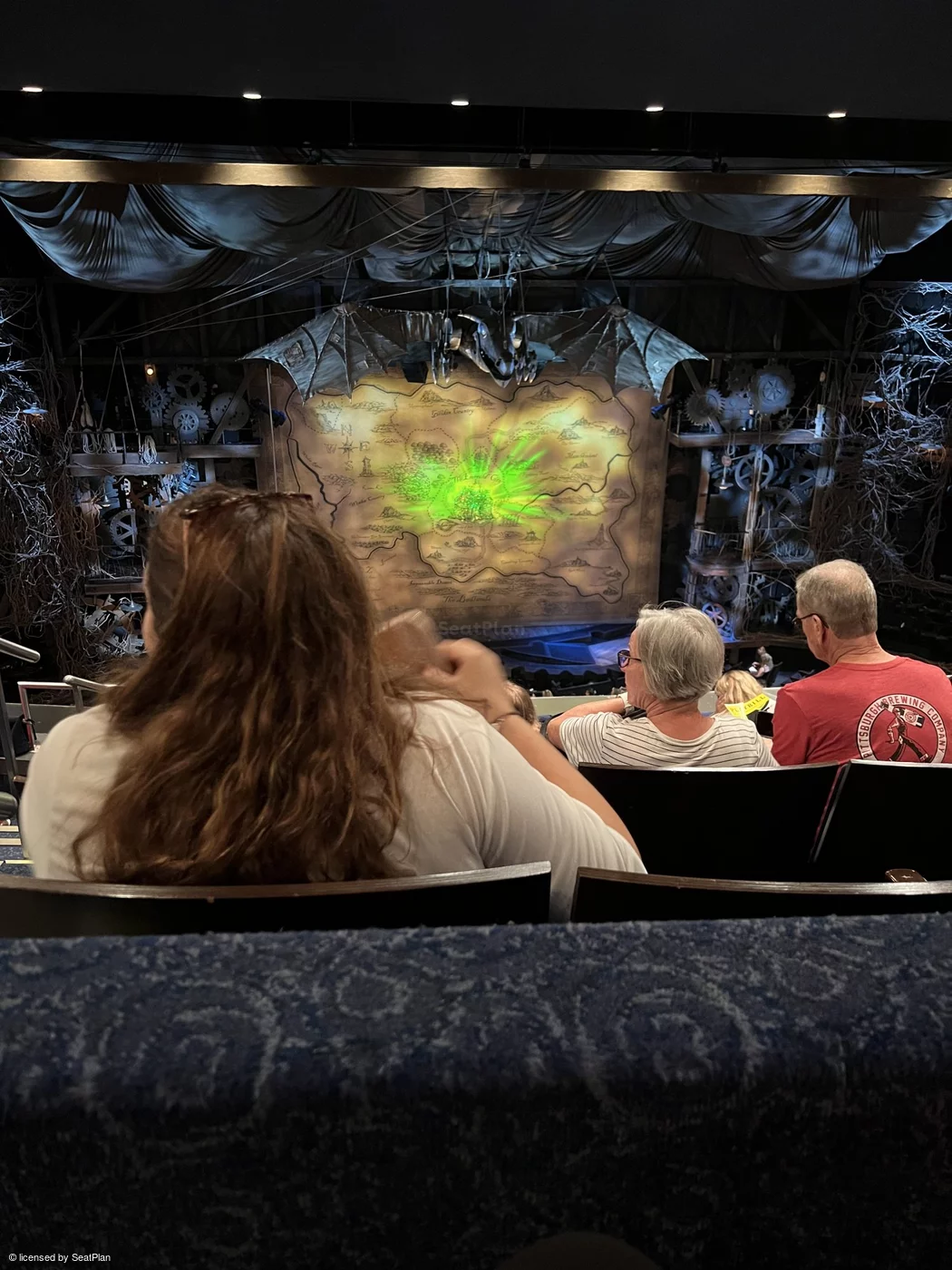 A seat view photo for Wicked Broadway It shows the stage at the Gershwin theatre, with the safety curtain down. as seen from the Mezzanine.
