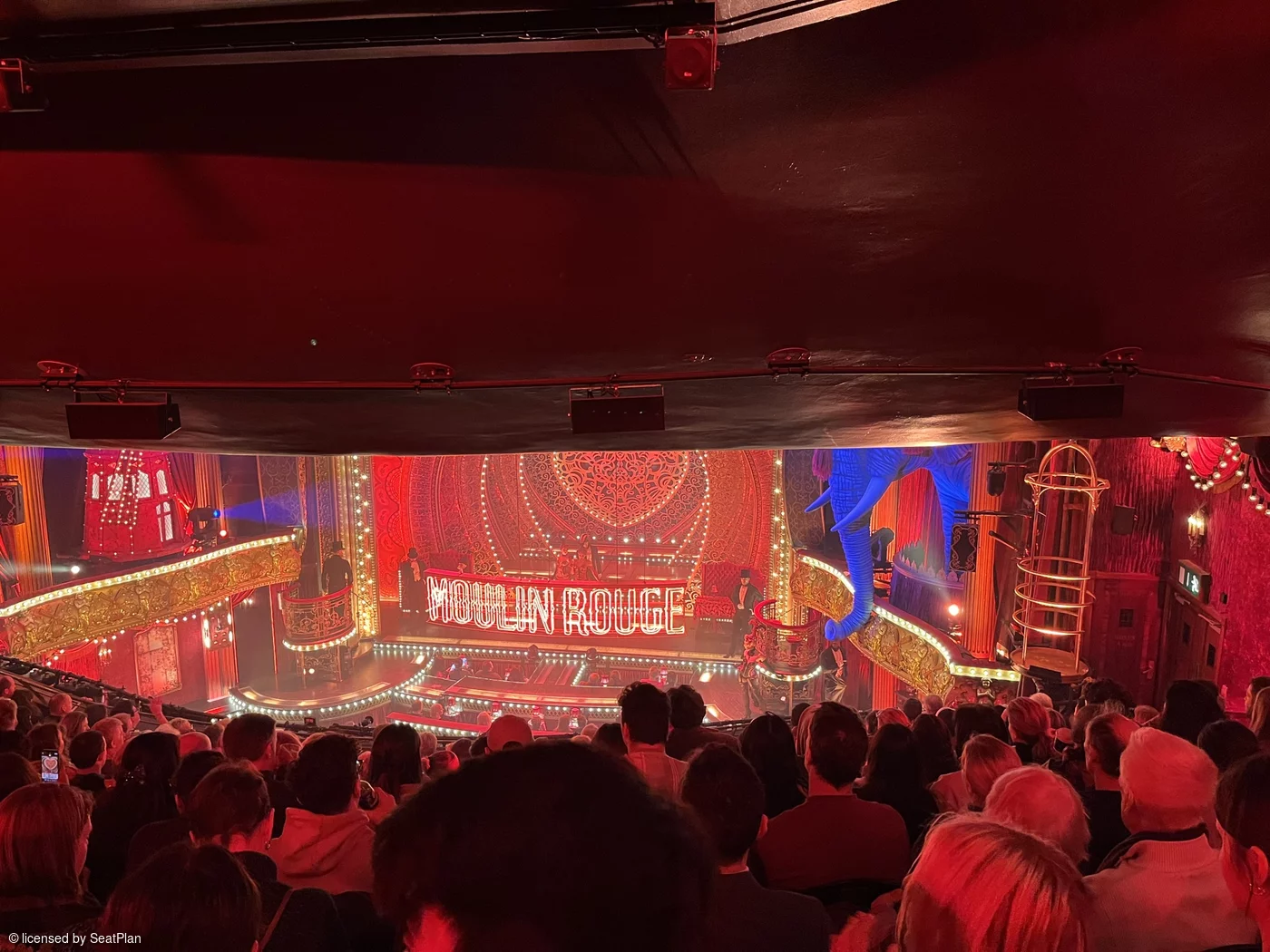 A photo from the Royal Circle for Moulin Rouge the musical, showing a restricted view due to the overhang above. 