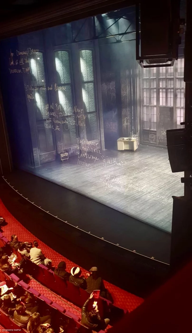 a seat view photo from box 1-2 at the prince edward theatre, showing the stage from a side angle.