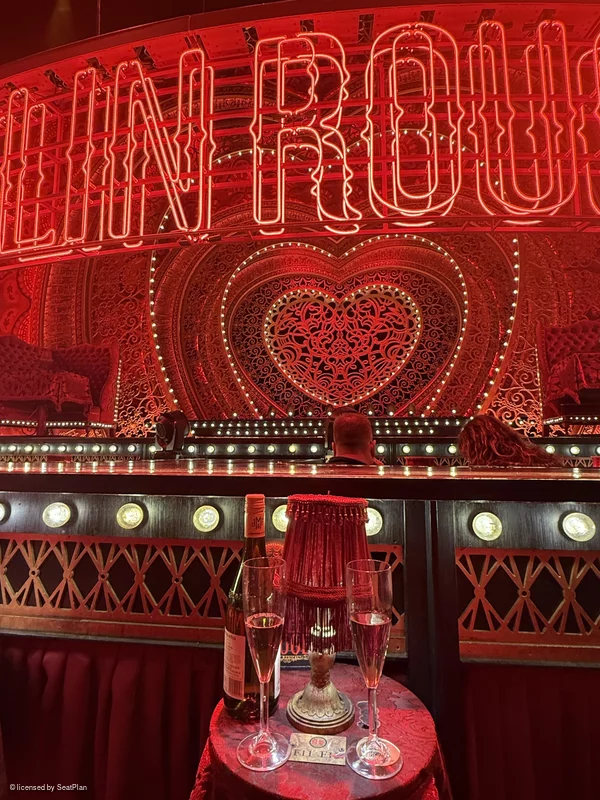 A seat view photo taken of the cabaret tables at Moulin Rouge the muiscal. 